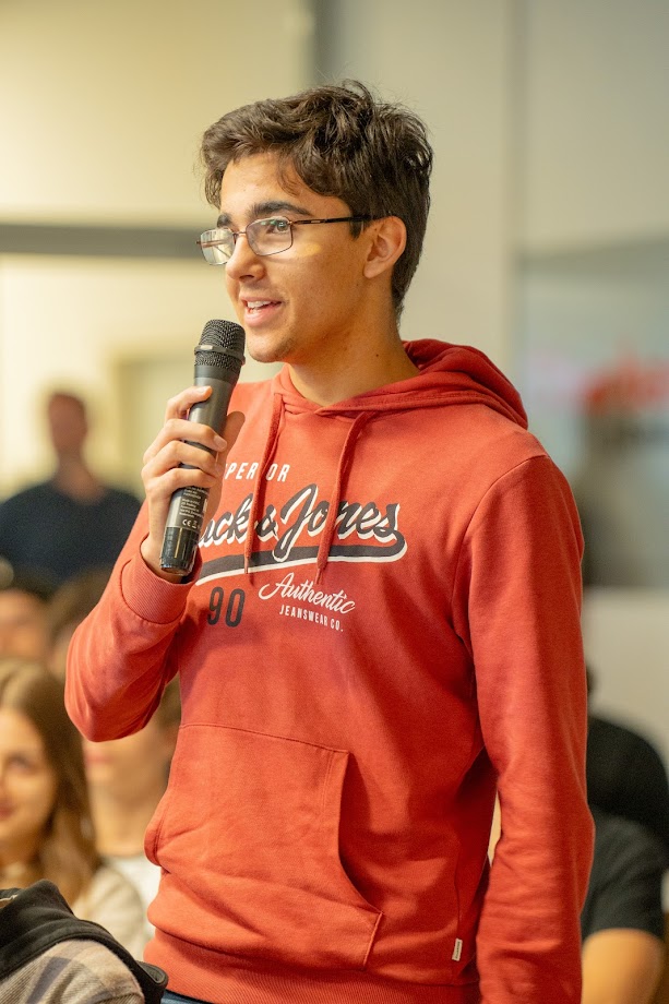 Mark Narain Enzinger at a podium discussion